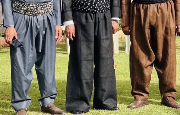 Kurdish şalwer — wide balloon trousers tapering to the ankle